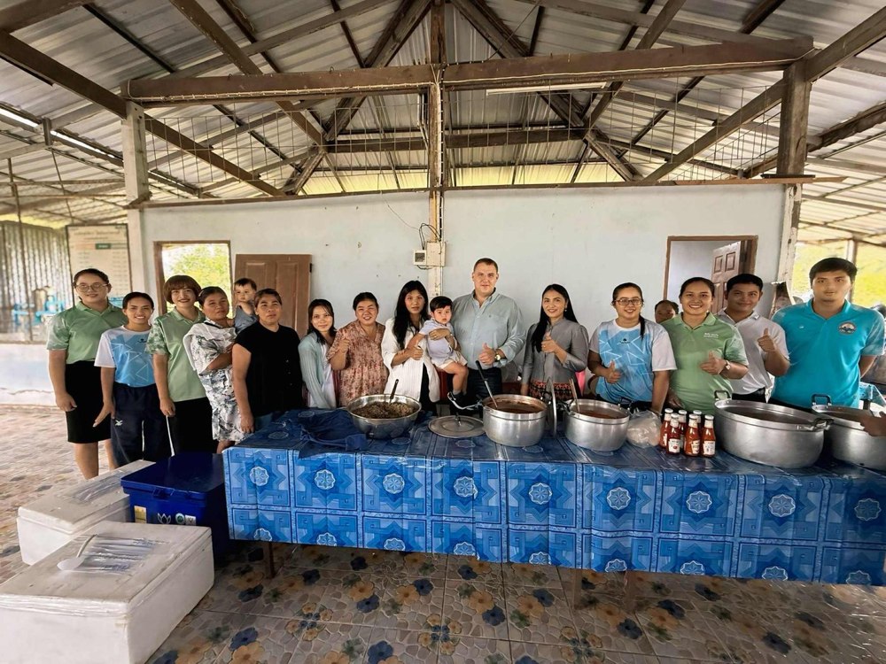 Ben Cunningham serving alongside community volunteers in Isan